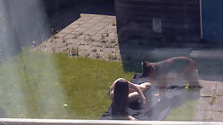 Sunbathing (Partly Topless)