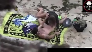 Voyeur-catches-on-video-a-horny-couple-fucking-on-the-beach