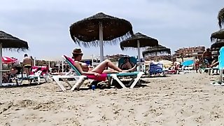 Brunette with huge tits on the beach - part 2
