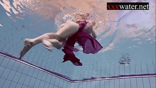 Smoking sexy russian redhead in the pool
